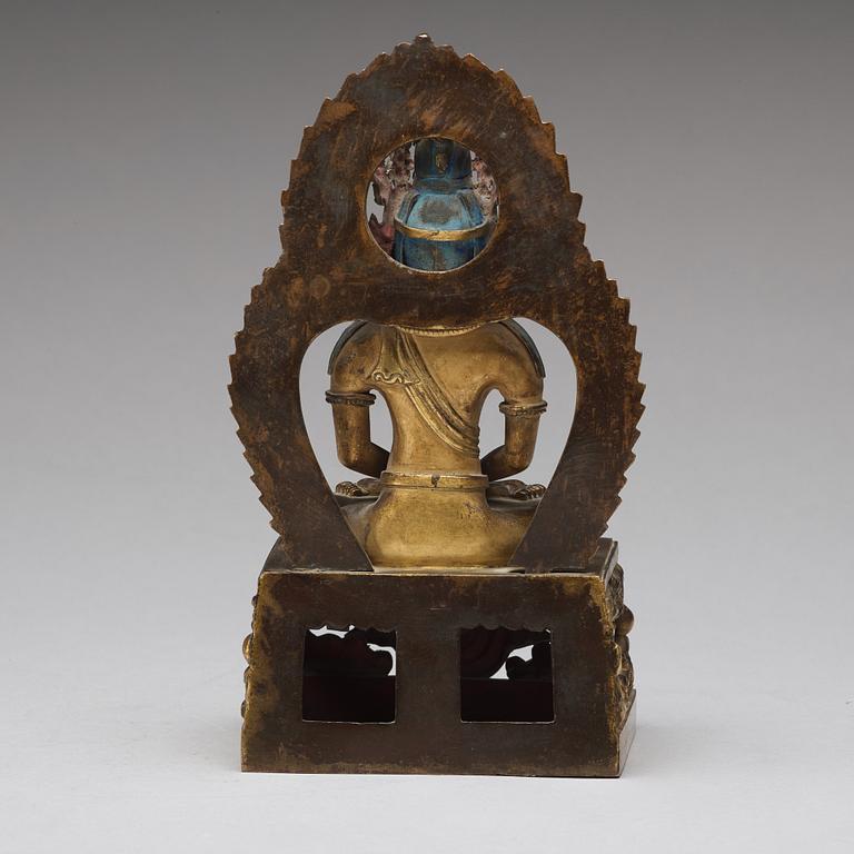 A gilt bronze seated figure of Amitayus, Qing dynasty, Qianlong period, dated by inscription.
