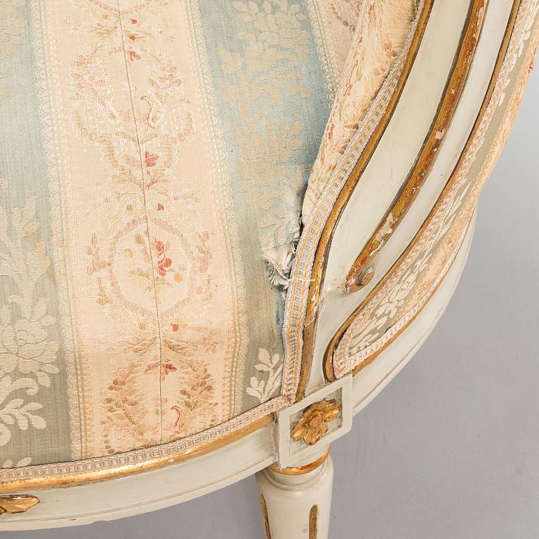 A Gustavian style sofa and table from early 20th century.