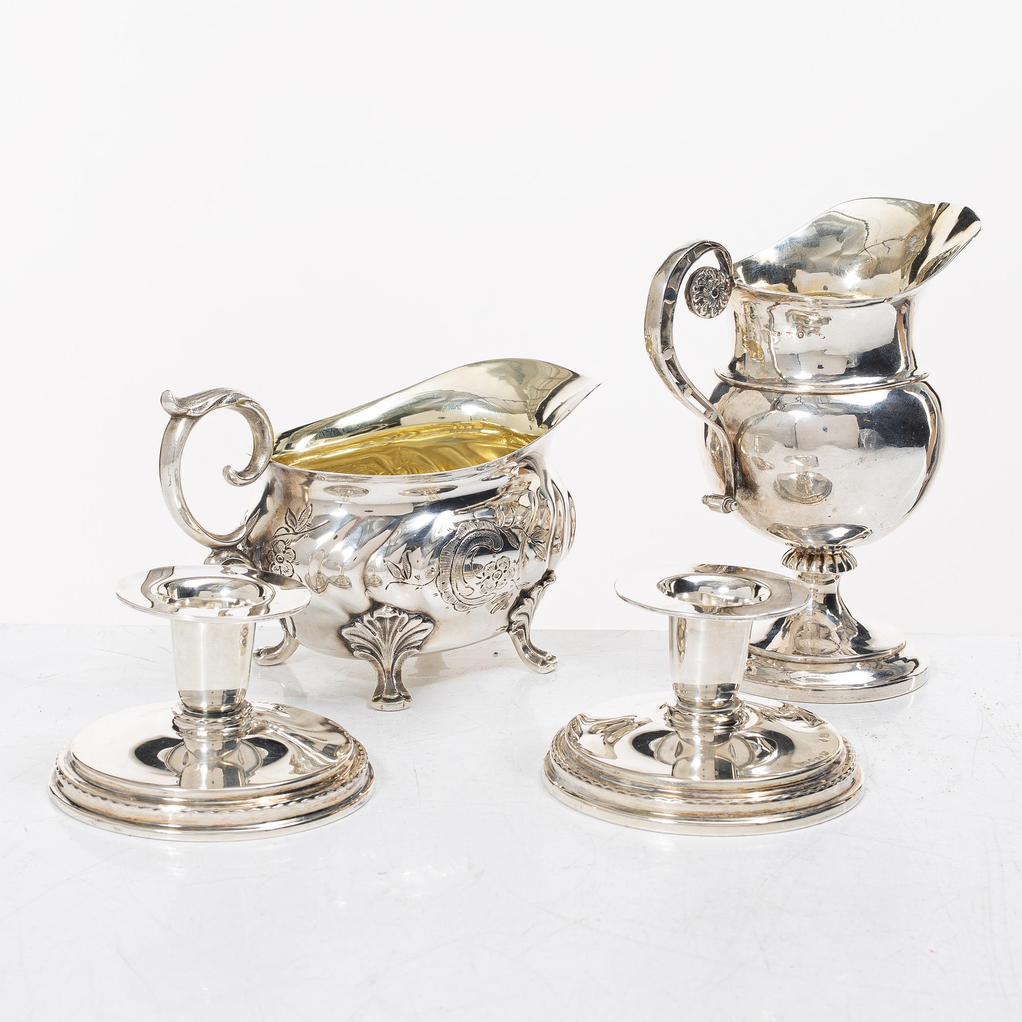 Two jugs and a pair of candlesticks, CG Hallberg among others.