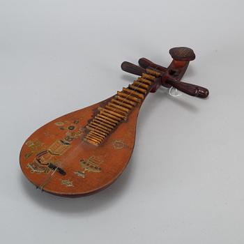 A Chinese wooden 'Pipa'/'flute' musical instrument, 20th century.