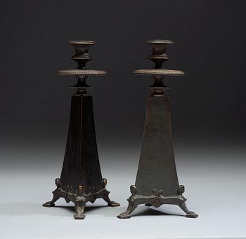A pair of Melchior Wernstedt bronze candelsticks, foundry Herman Bergman AB.