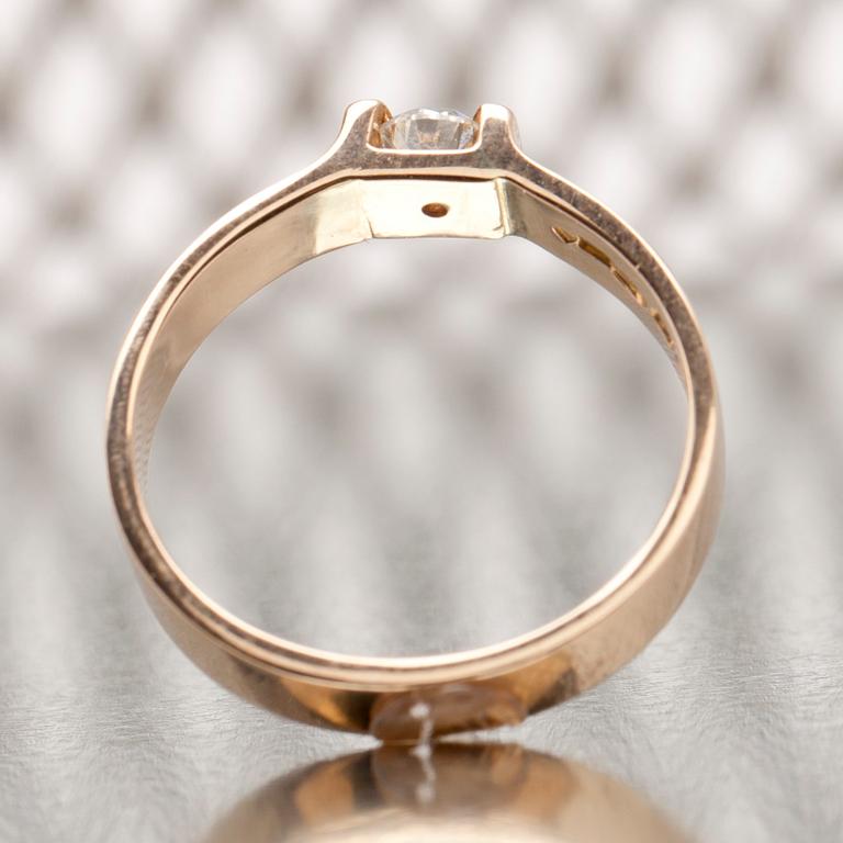 RING, 14K guld, briljantslipad diamant ca 0.25 ct uppskattningsvis W/vs. Henri Sörensen Åbo 1999. Vikt 4,5 g.