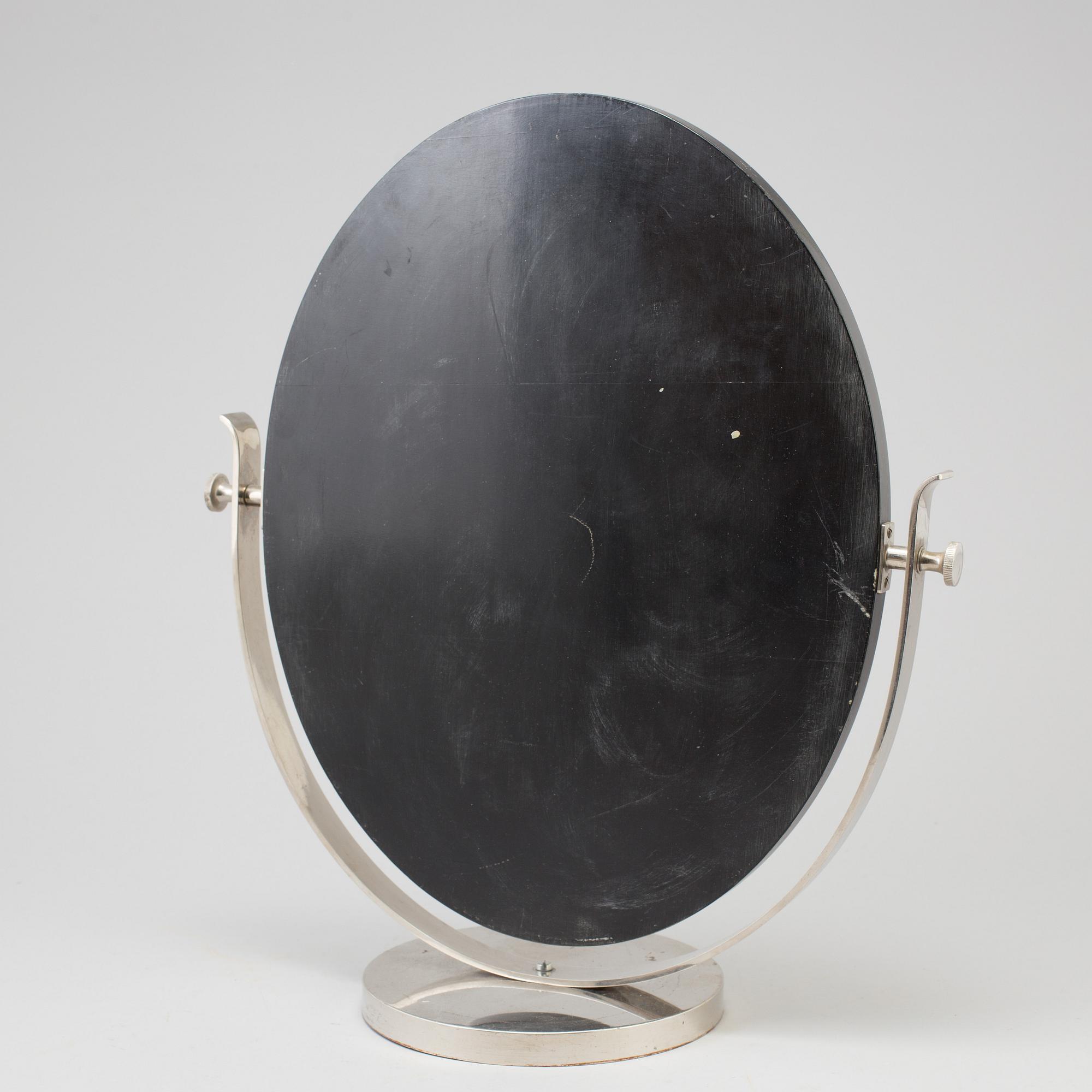 A 1930s art déco table mirror.