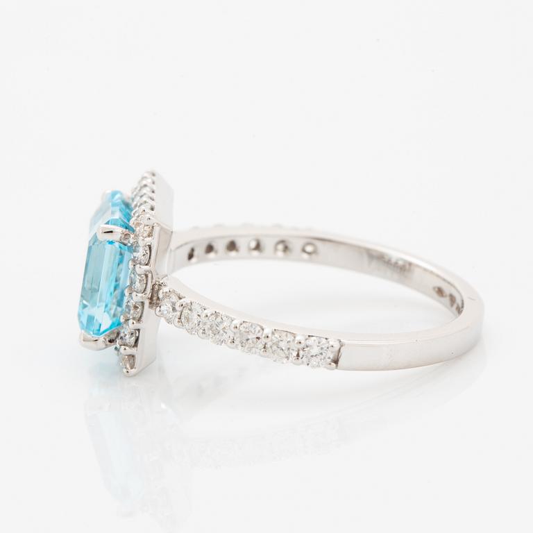 Blue topaz and brilliant-cut diamond ring.