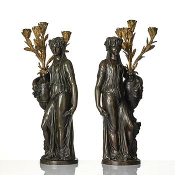 A pair of Louis XVI-style four-light gilt and patinated bronze candelabra after Clodion, later part 18th century.