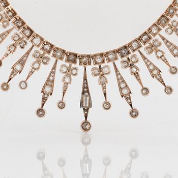 A tiara/necklace combination in 9K gold and silver set with old-cut diamonds with a total weight of ca 12.00 cts.