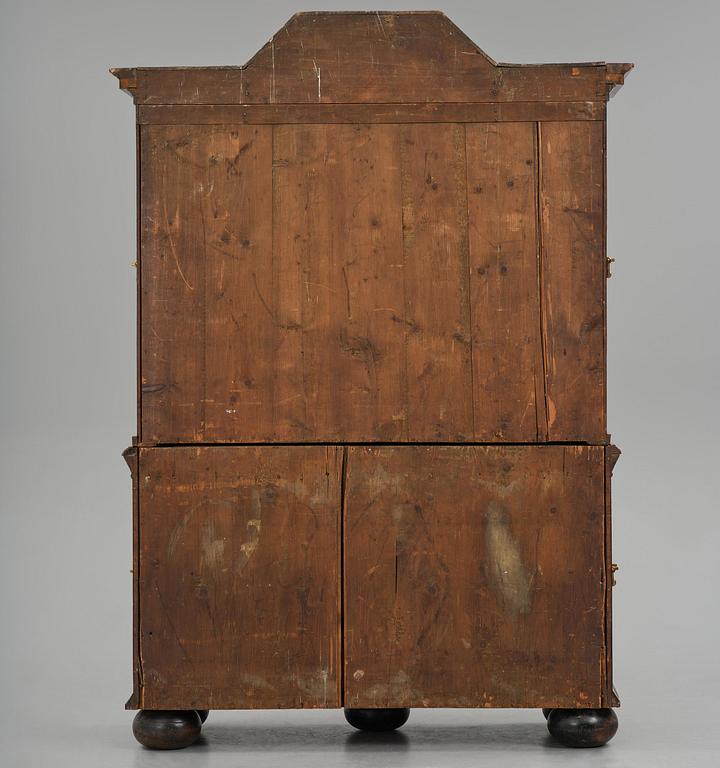 A Swedish late baroque burr-alder cabinet, first part 18th century.