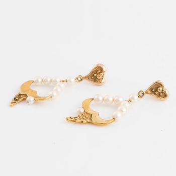 Gold and cultured pearl earrings.