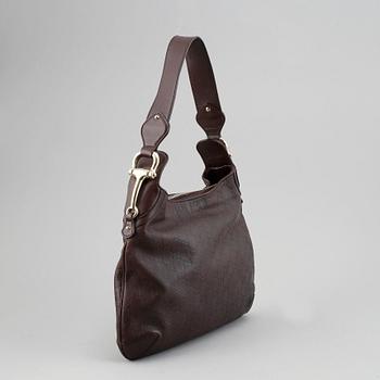 Gucci, a leather bag.