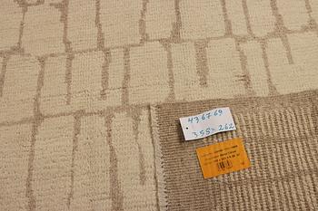 A Moroccan carpet, modern design, c. 358 x 262 cm.