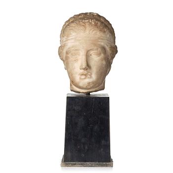 213. A Greek marble head of a deity wearing a Dionysiac fillet, Hellenistic style presumably 16th century.
