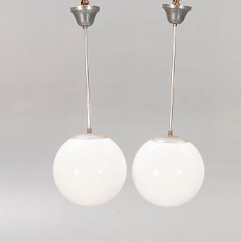 A pair of 1930s glass and chromed ceiling lights.