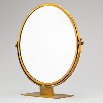 A mid-20th century brass table mirror by Ystad Metall.