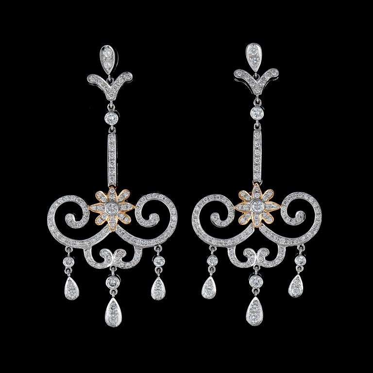 A pair of diamond, circa 1.75 cts in total, earrings.