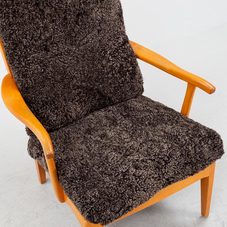 Carl Malmsten, a 'Stora Fjäderbrickan' armchair, second half of the 20th Century.