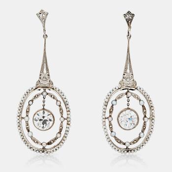 480. A pair of seed-pearl and diamond earrings. Total diamond weight circa 2.50 cts.