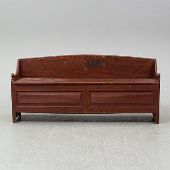 A 19th century painted wood sofa.