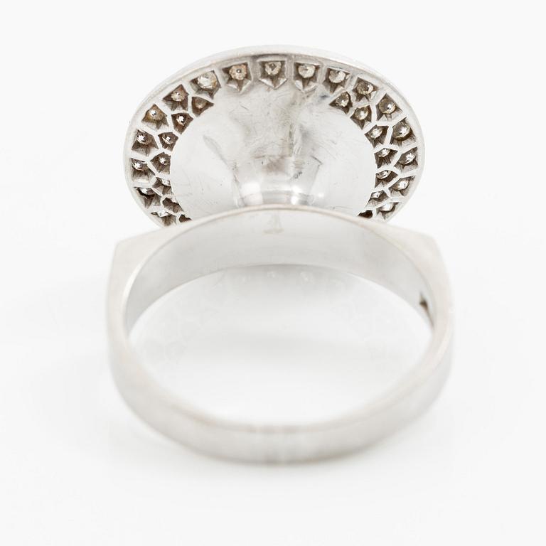 A ring 18K white gold set with an opal and eight-cut diamonds. CF Carlman, Stockholm 1973.