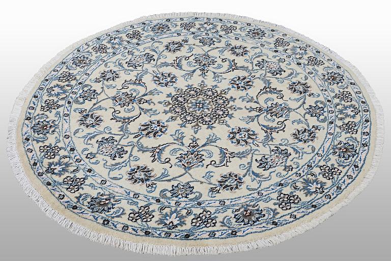 A rug, Nain, part silk, ca 316 x 136 cm.