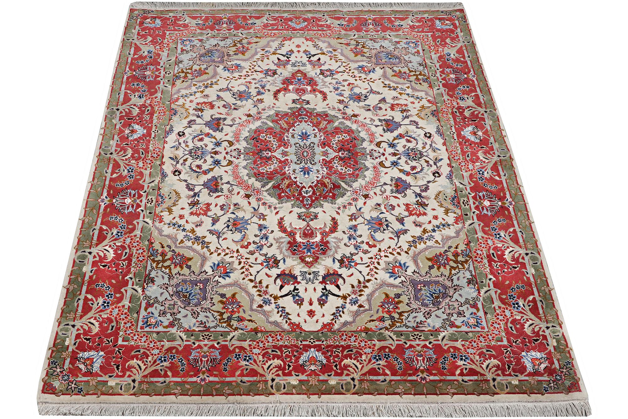 A Tabriz rug, part silk, 50 raj, c. 204 x 154 cm.
