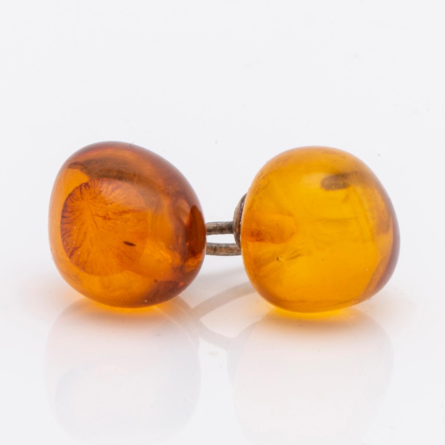 Amber set in silver, pendant, ring and earrings.
