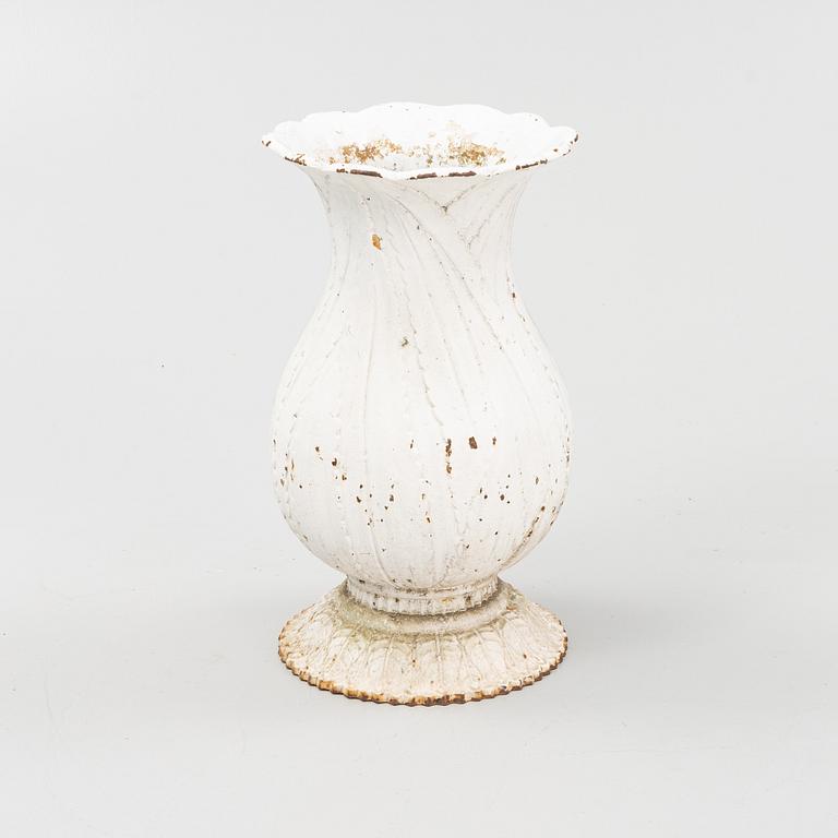 A 20th Century cast iron garden urn.