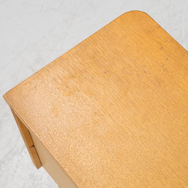 A pair of oak veneered bedside tables, mid 20th Century.