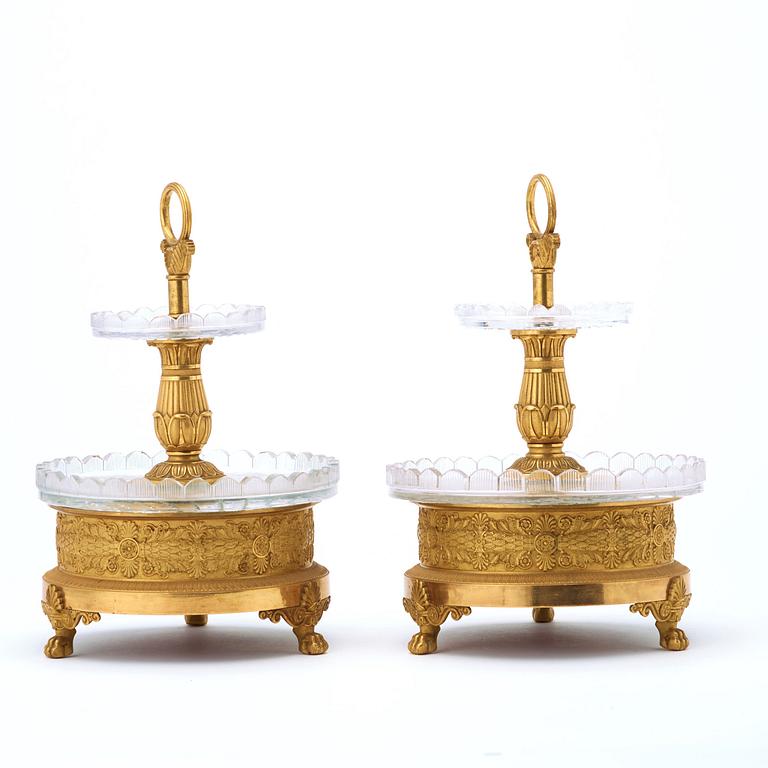 A pair of French Empire early 19th century gilt bronze and glass centre pieces by Pierre Philippe Thomire (1751–1843).