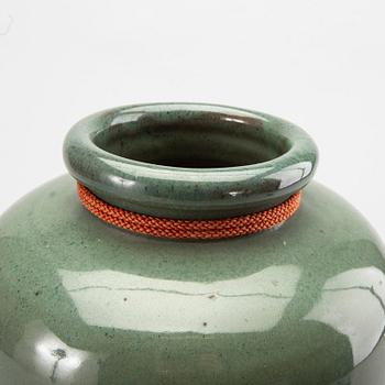 A Japanese eraly 20th century stoneware jar.