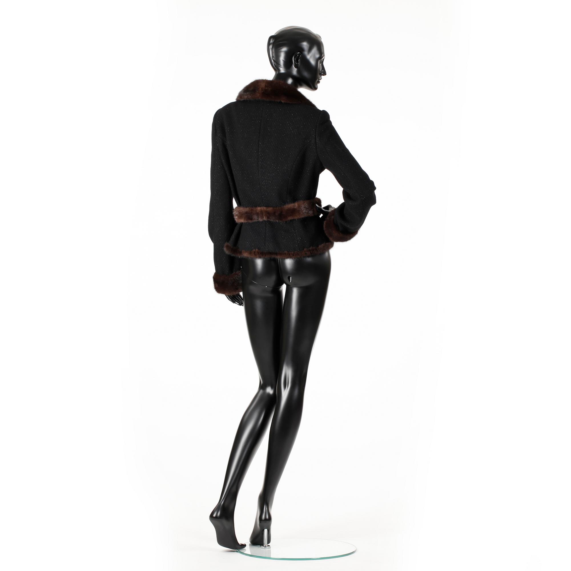 BLUMARINE, a black wool jacket with mink fur.