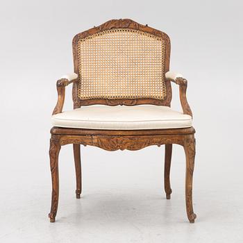 A French Louis XV armchair, mid 18th century.