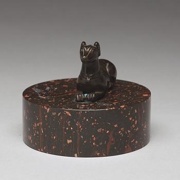 A bronze figure of a reclining dog, 17/18th Century.