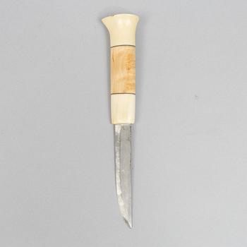 Oskar Tjäder, A reindeer horn knife, signed.