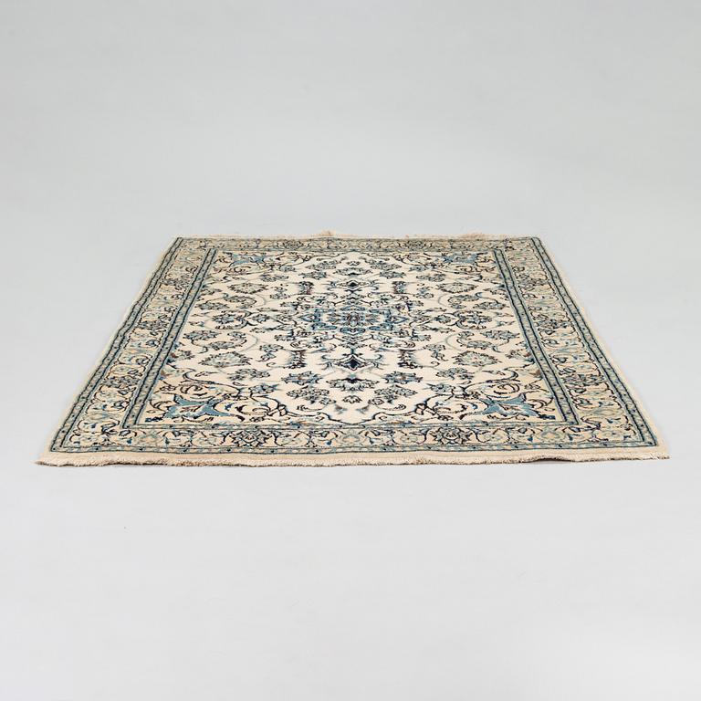 A carpet, Nain Part Silk. Ca 185 x 123 cm.