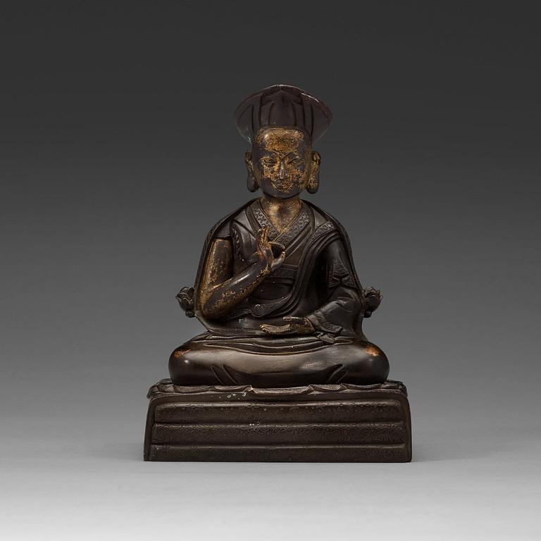 A Sino-Tibetan bronze figure of a Lama, early 20th Century.