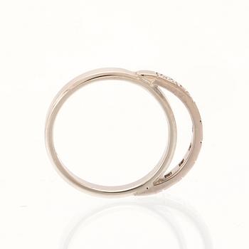 An 18K white gold ring set with round single cut dimamonds.