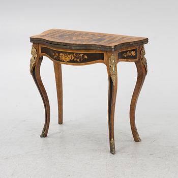 A Louis XV-style games table, early 20th century.