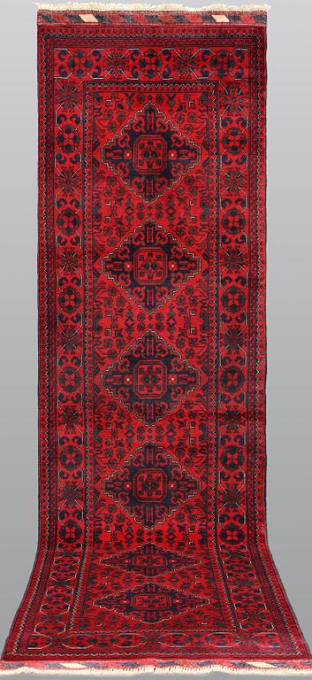 An Afghan runner, approx. 286 x 84 cm.