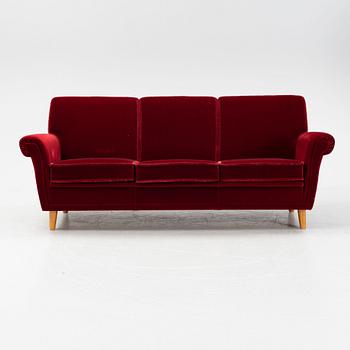 A velvet upholstered sofa, mid 20th Century.