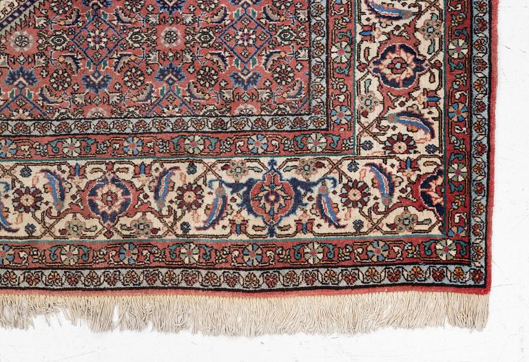 An oriental rug, approx. 238 x 174 cm.