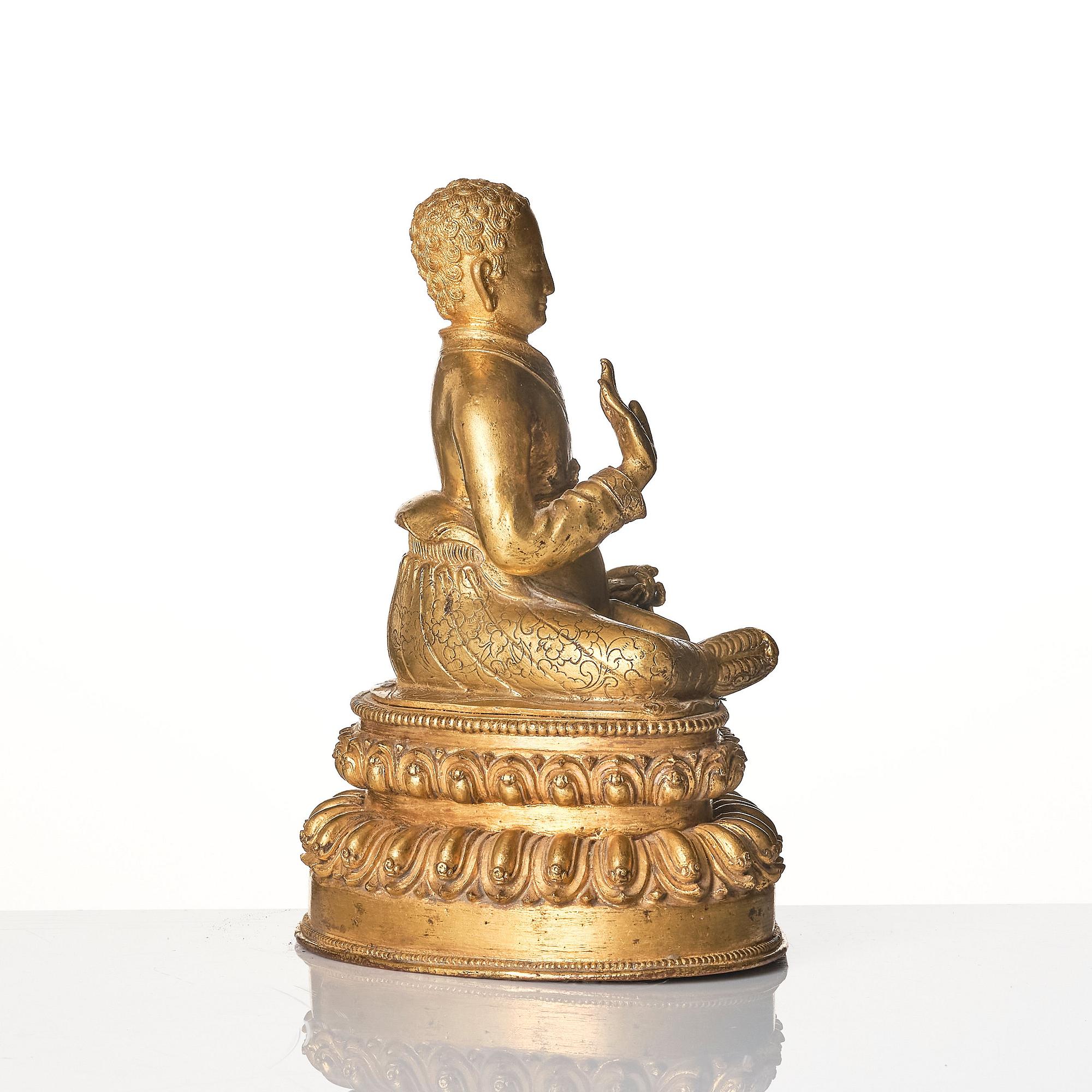 A gilt copper alloy figure of a Lama, most likely Sonam Tsemo, Tibet, probably 16/17th century.
