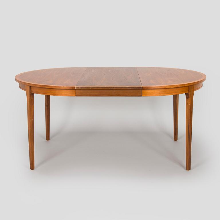 A 1960s teak and oak dining table.