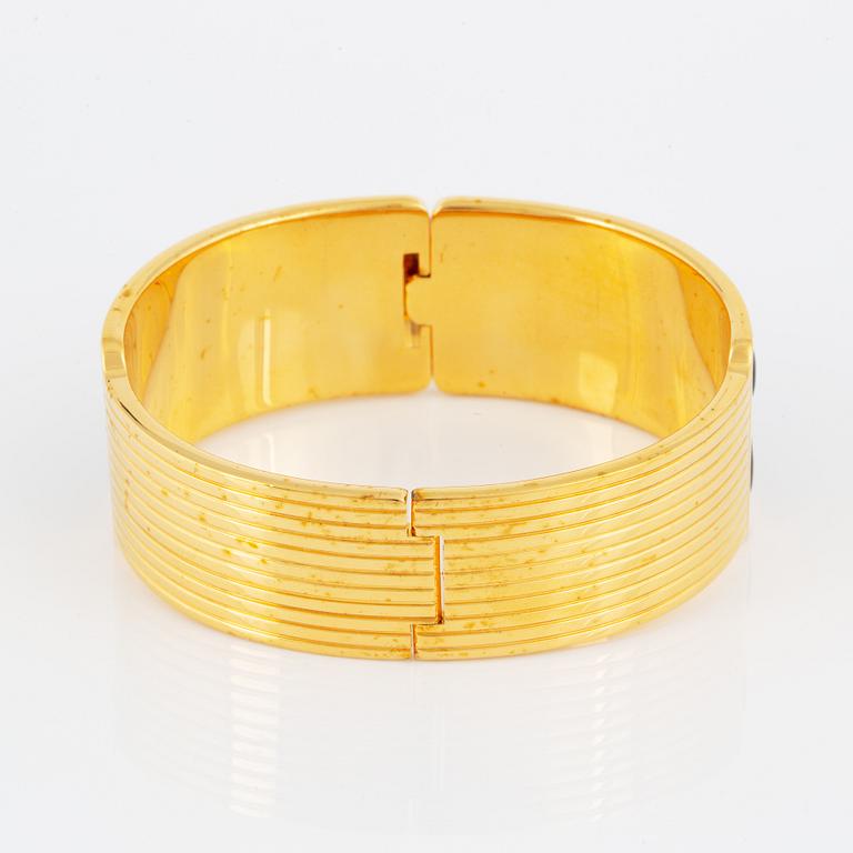 FREY WILLE, an enamel and gold plated metal bangle.