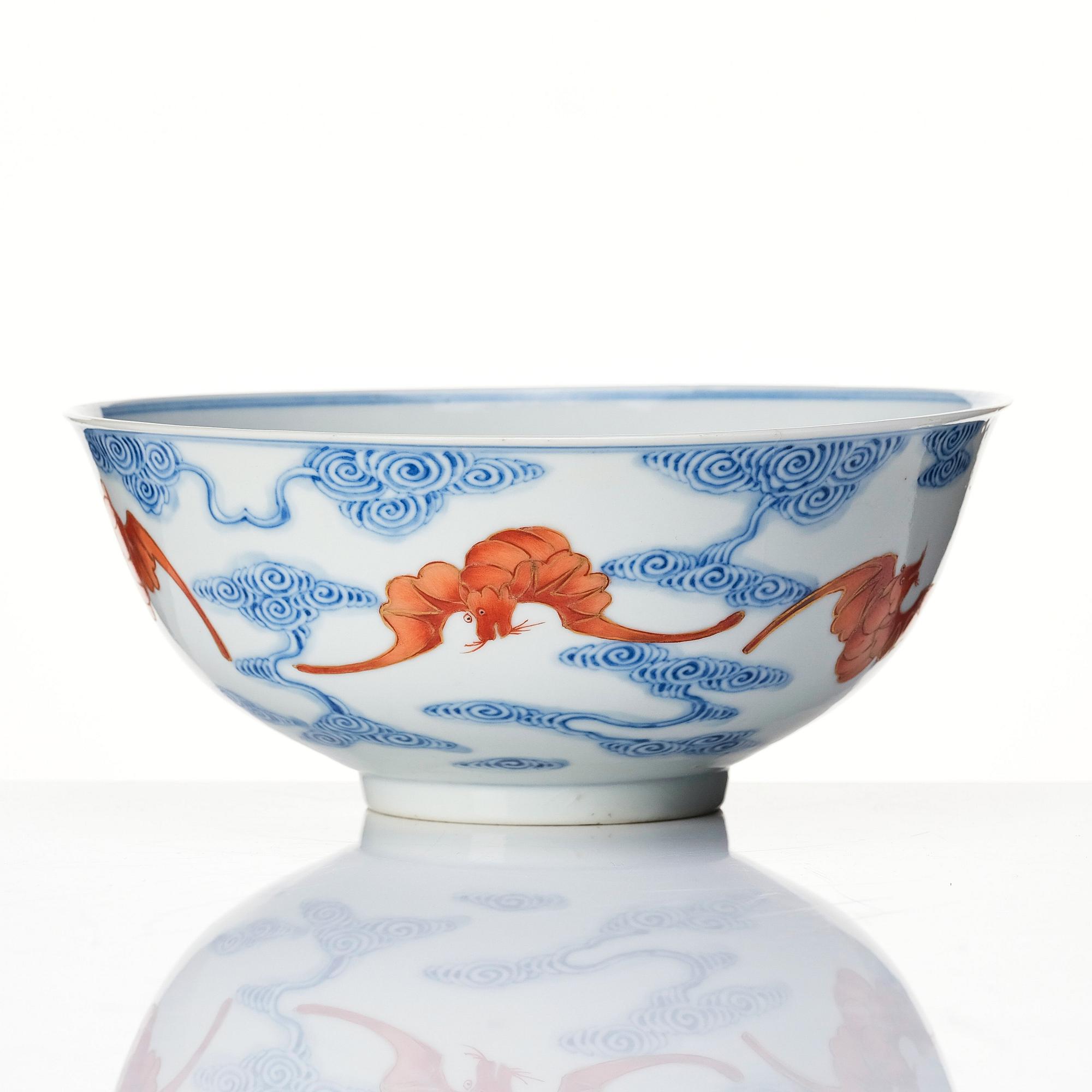 A Chinese iron-red-decorated blue and white Wufu bat bowl, late Qing dynasty, around 1900.