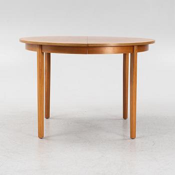 A teak veneered dining table, second part of the 20th Century.