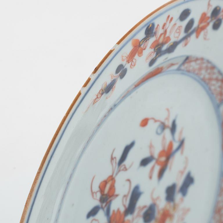 A group of Chinese imari porcelain comprising four plates, three dishes and a cup, Qing dynasty, 18th century.