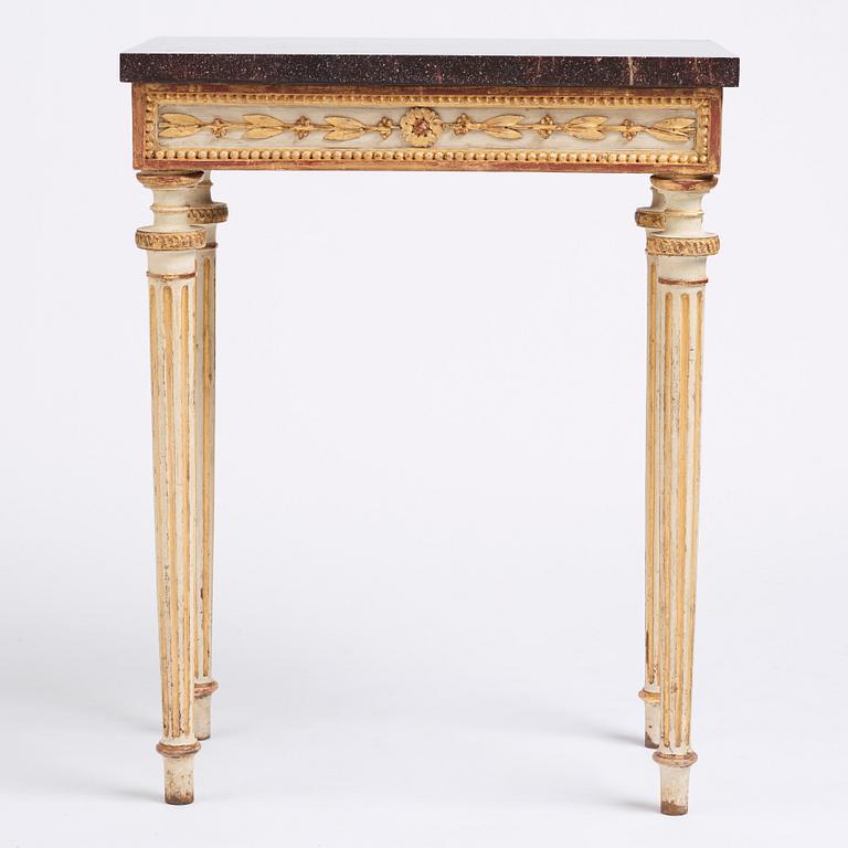 A late Gustavian console table in the manner of P Ljung, late 18th century. Stone top in porphyry.