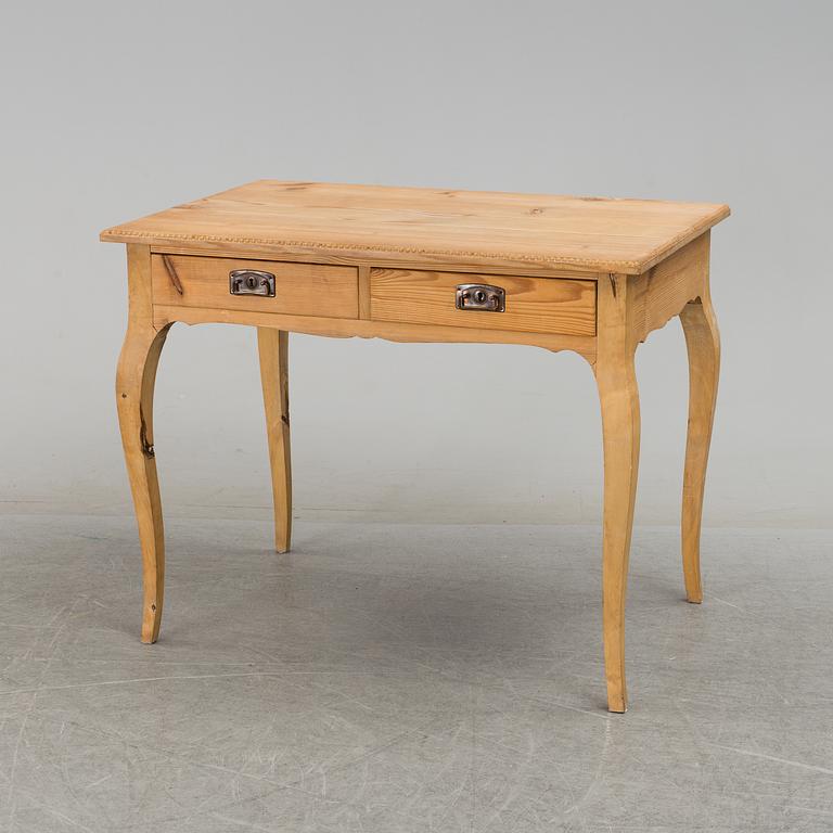 A 20th century rococo style writing desk.