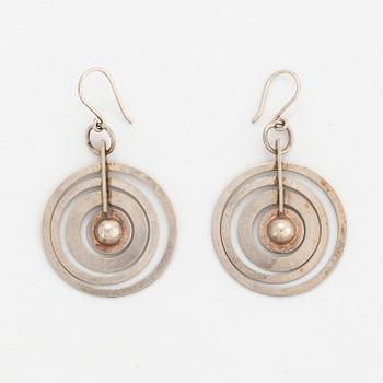 A pair of silver Tapio Wirkkala earrings.