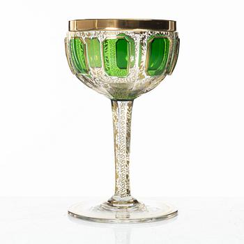 A cut, gilded and coloured glass service, 20th century. (19 pieces).